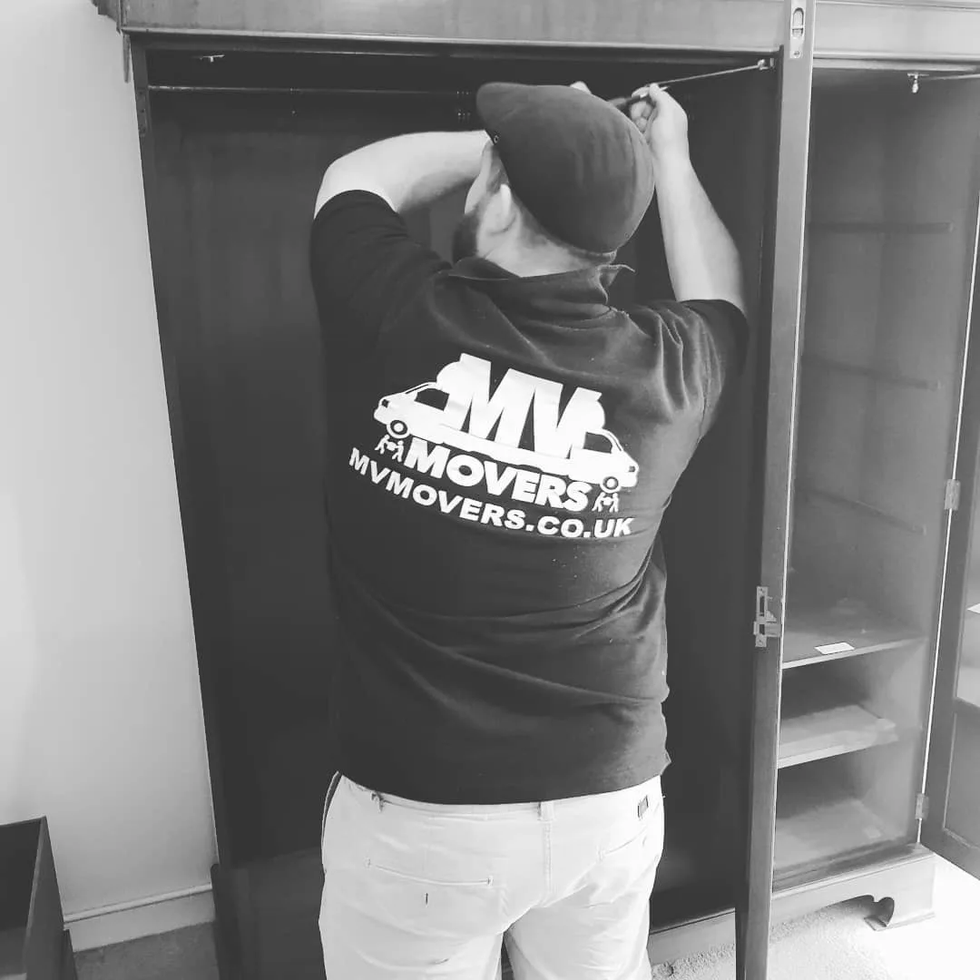 MV Movers team member assembling a wardrobe