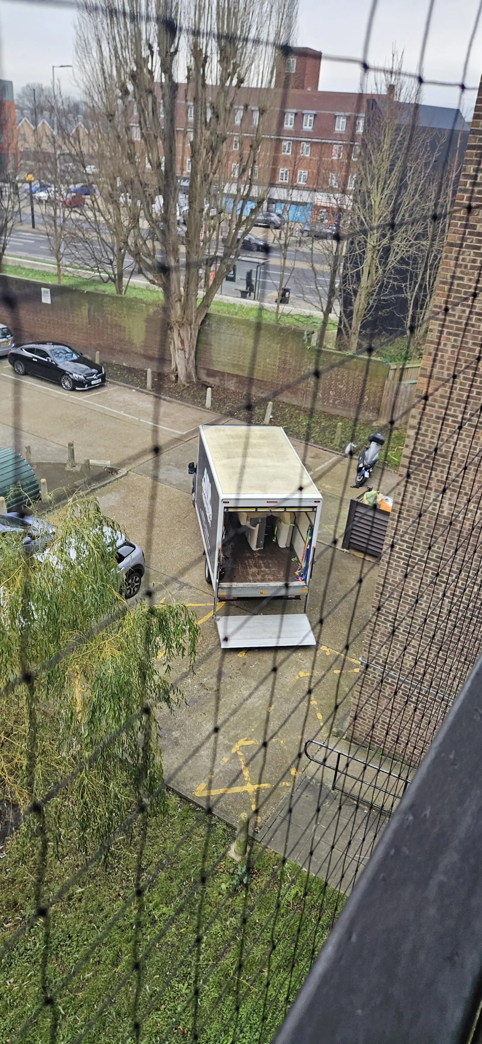 MV Movers van positioned for a courtyard collection