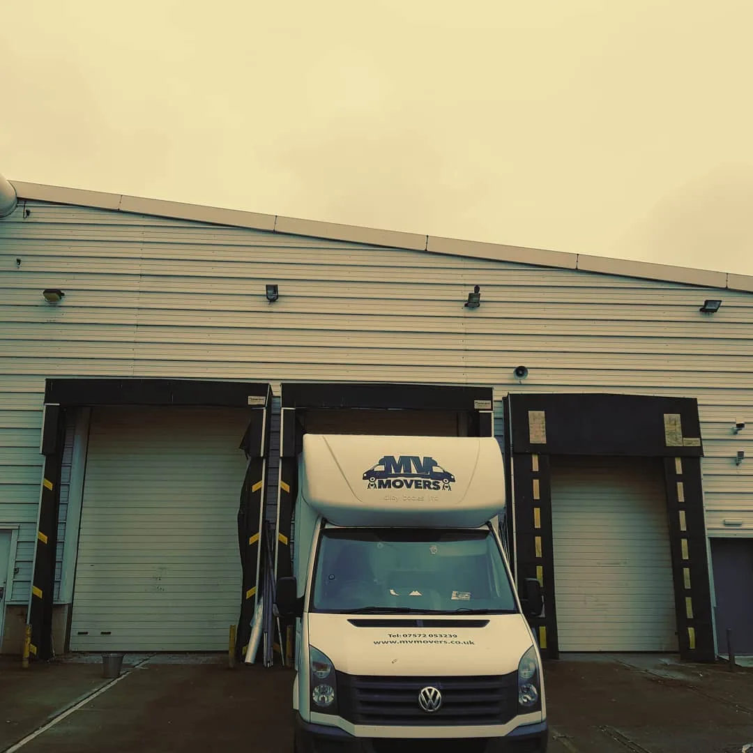 MV Movers vehicle loading at a warehouse bay